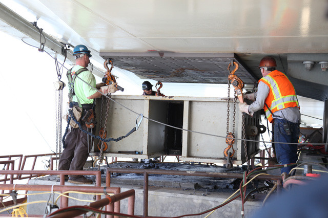 Construction crews continued working on the steel saddle retrofit below the roadway September 4, seen here removing temporary bearings north of the E2 shearkey. Photo courtesy of Caltrans